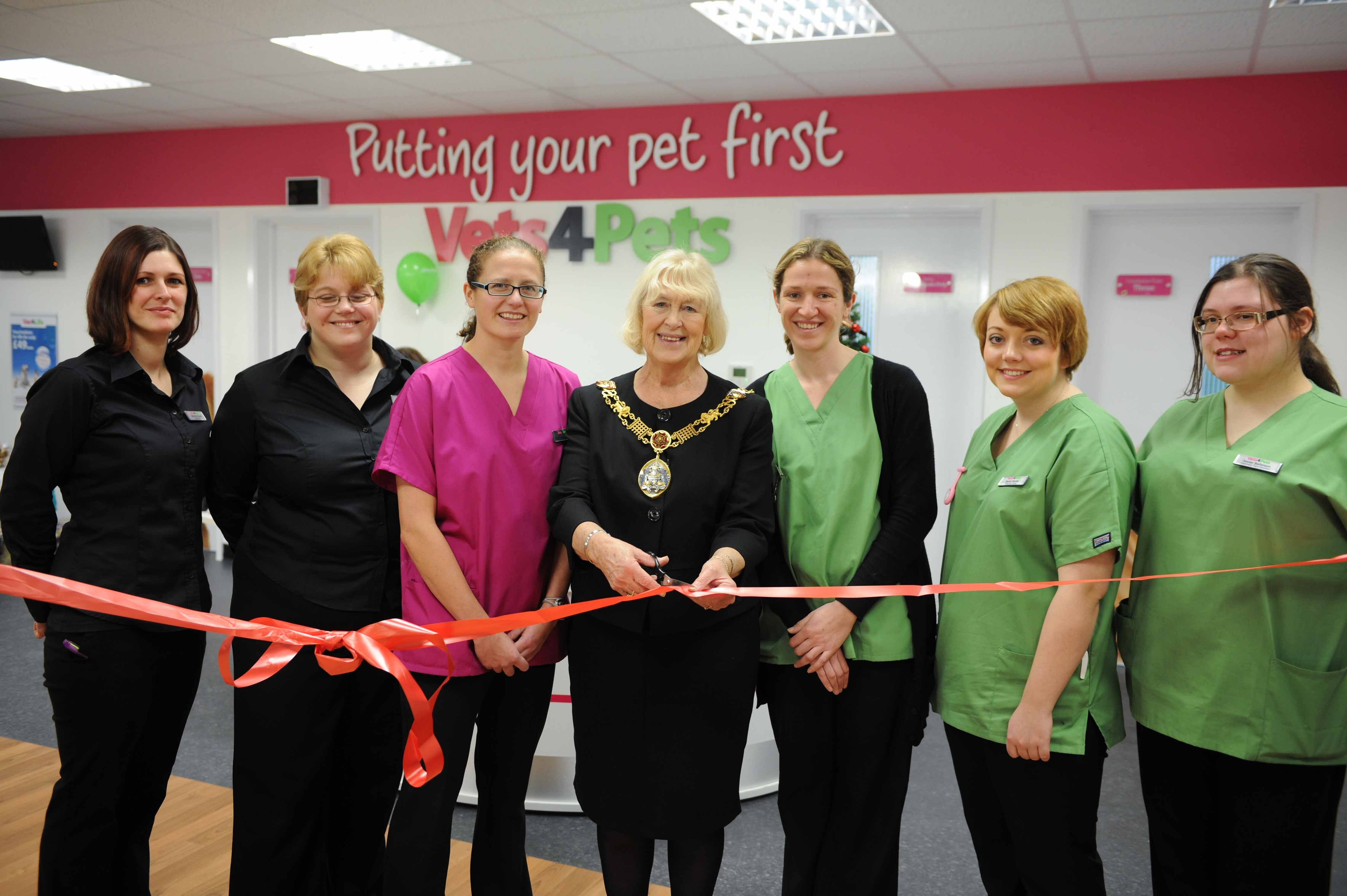 Pictured: Louise and Phyllis with their new team, with the Mayor cutting the ribbon.  