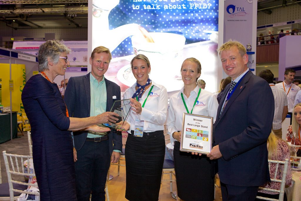 Liz Barrett Equine Business Manager for Boehringer Ingelheim and Nick Todd Director of Stand Creative and Andy Hogan, Commercial Director at Burtons Medical Equipment receiving the Veterinary Practice Best large Stand Award from Marion McCullagh of Veterinary Practice magazine and Mark Bowen, BEVA President.