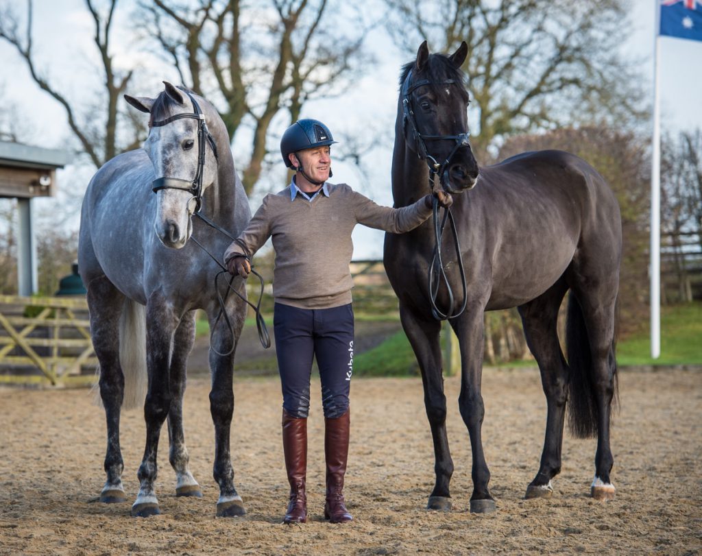 Andrew Hoy with two of his string: On the left seven-year-old gelding Brigant, by Caesar van de Helle and on the right four-year-old approved stallion OSO Monolitos, by Huzar